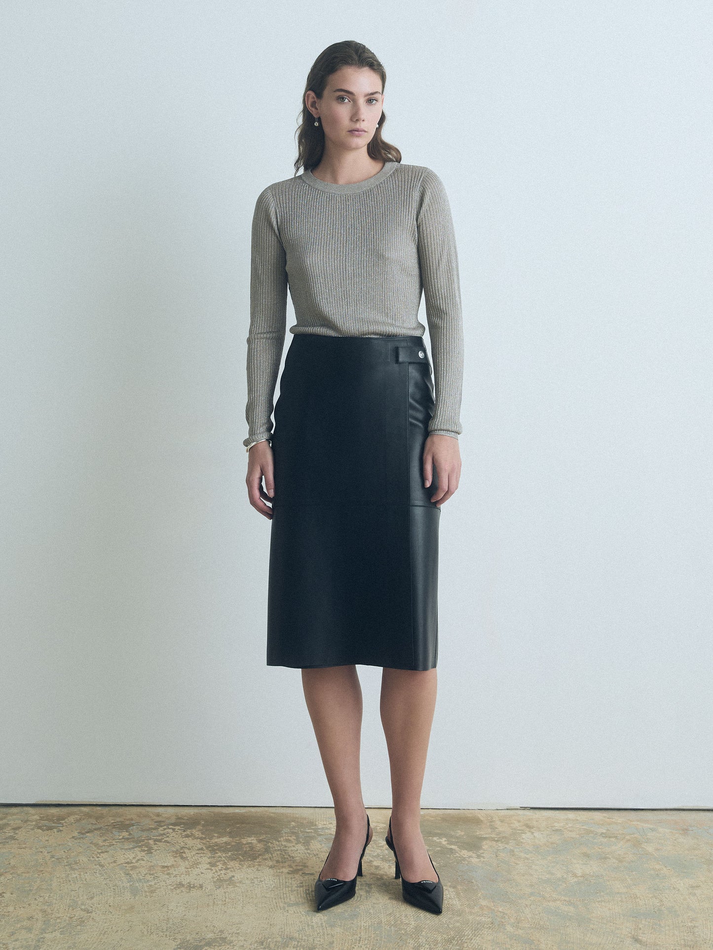 Woman wearing Taupe long-sleeve Tyra pullover by Judith and Charles with crew neck, fitted silhouette, made from Italian viscose-metallic fabric.