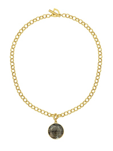 Gold necklace with a round stone pendant on a white background