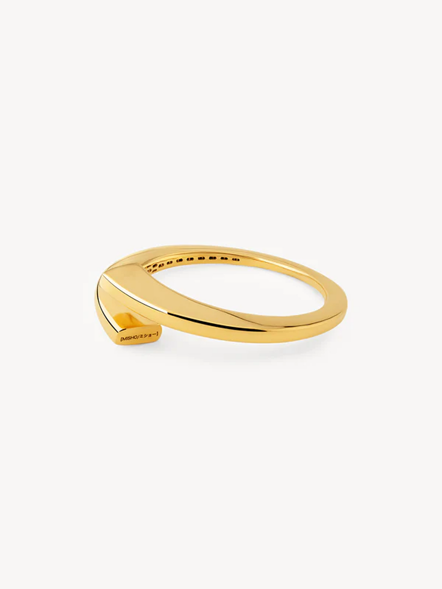 Gold bangle on a white background