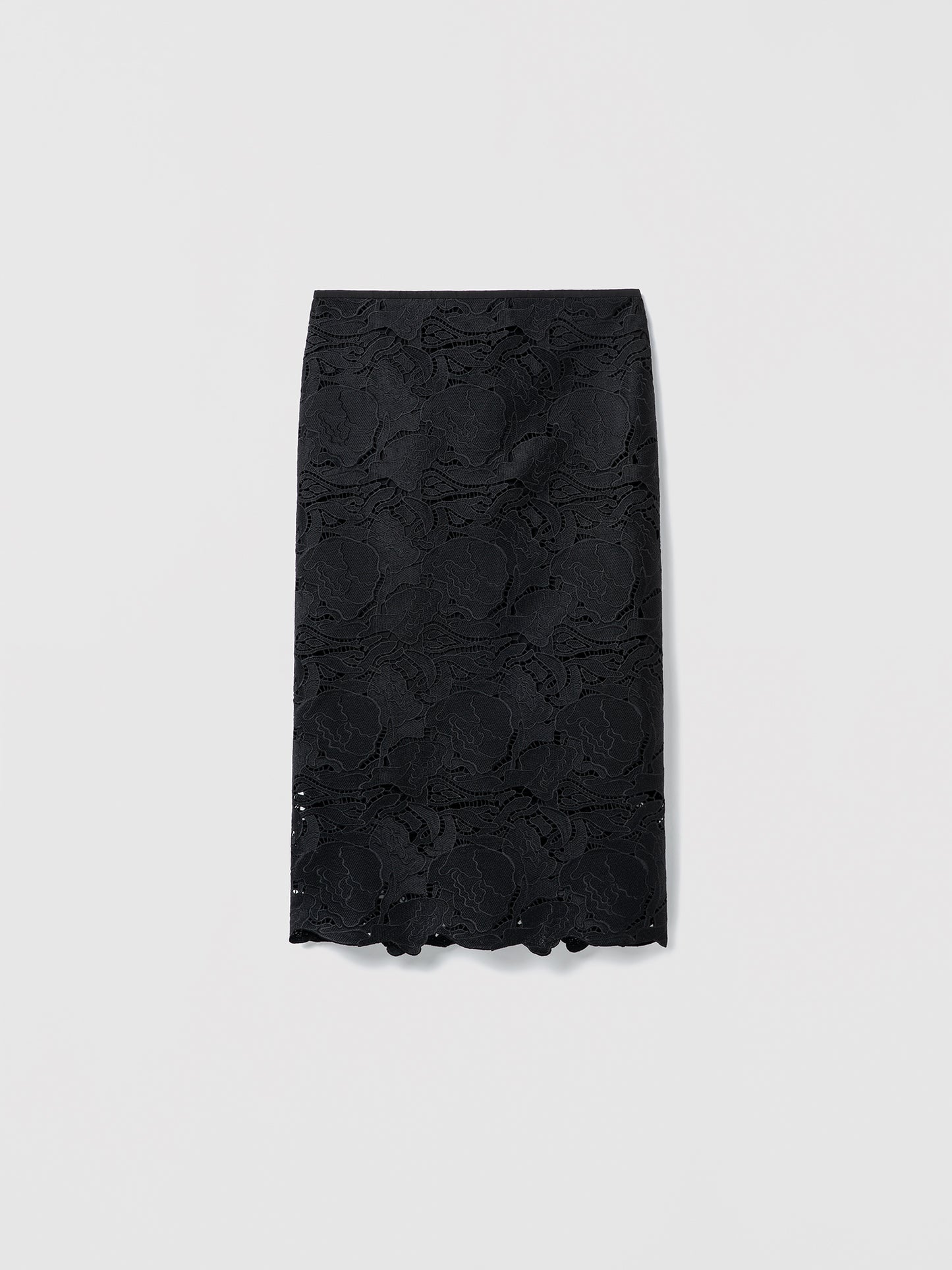 Flat shot of a clean, fully lined floral lace skirt on a white background.