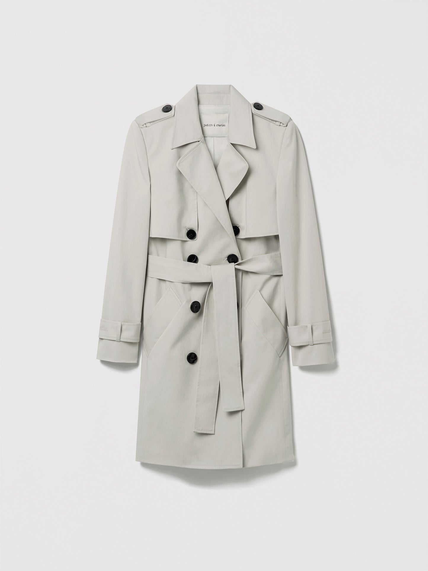 Pearl trench coat on a white background