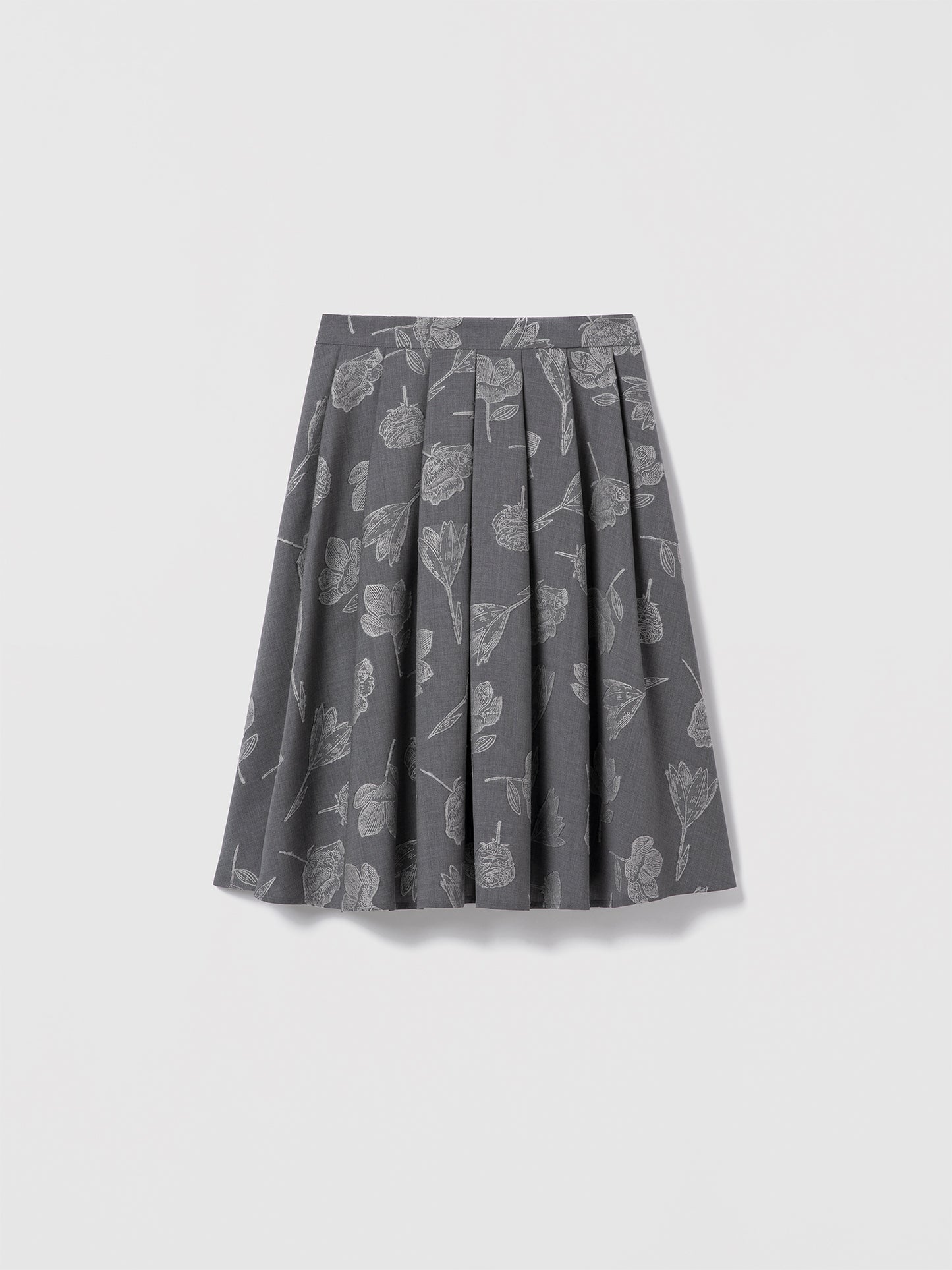 Grey floral jacquard skirt in stretch virgin wool by Loro Piana, below-the-knee length with side seam pockets, clean waist, and invisible back zipper. Unlined. Made in Canada with Italian fabric. Mecca Skirt, style 725-2531 by Judith & Charles