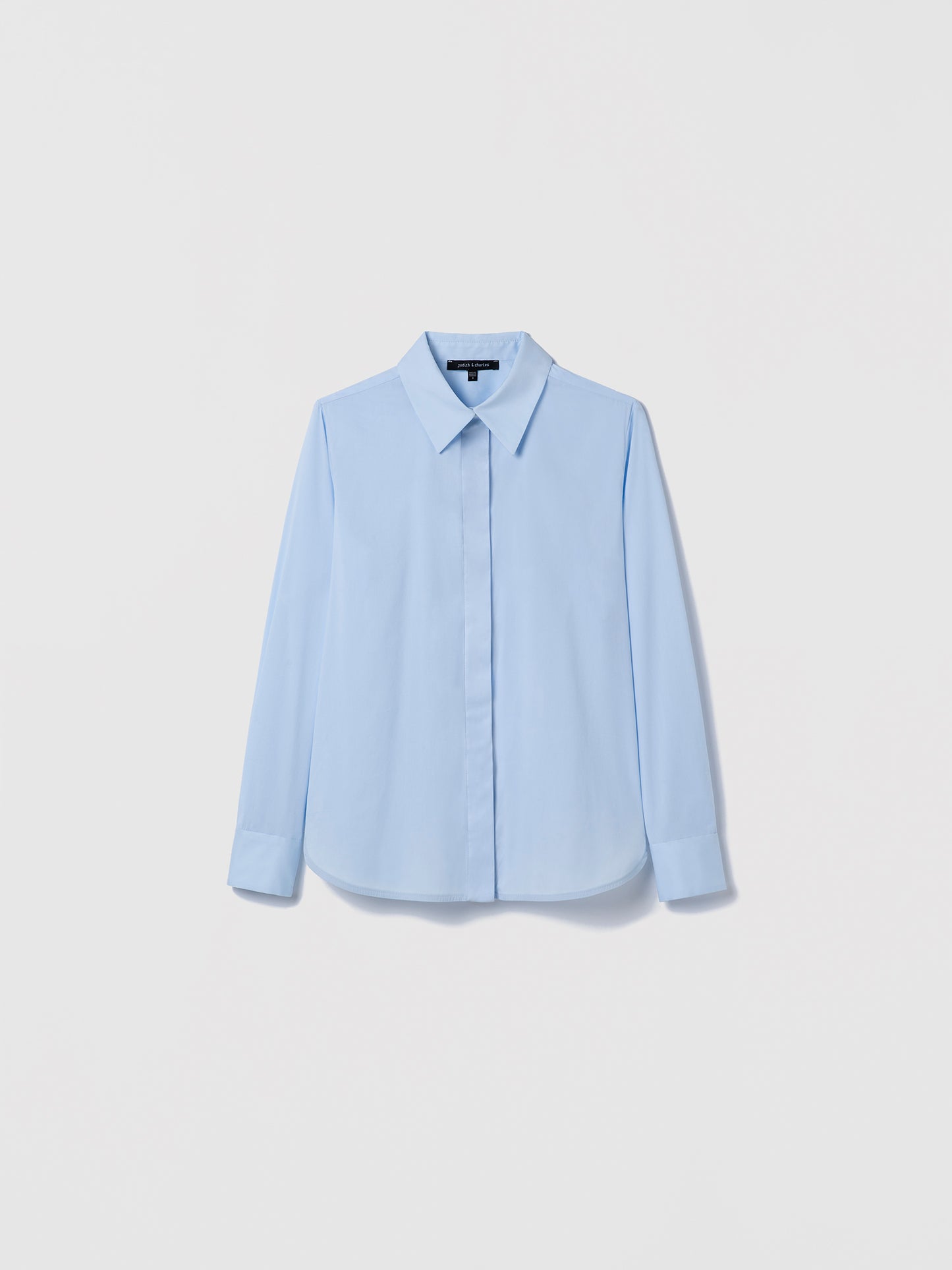 Pale blue Cotton‑blend blouse with spread collar and hidden button placket shown in a clean, structured silhouette