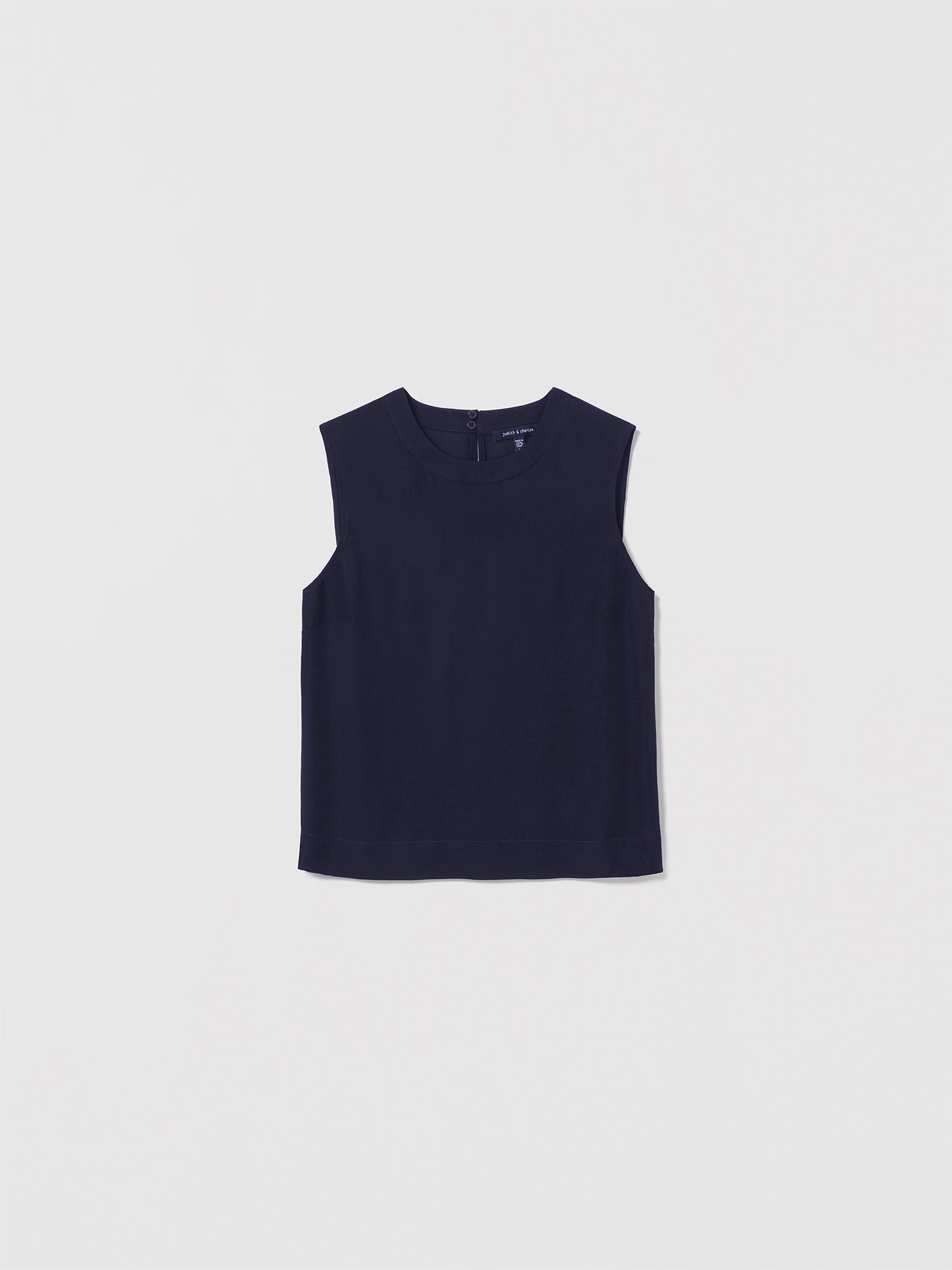Judith & Charles navy sleeveless silk blouse with crew neck and back keyhole closure.