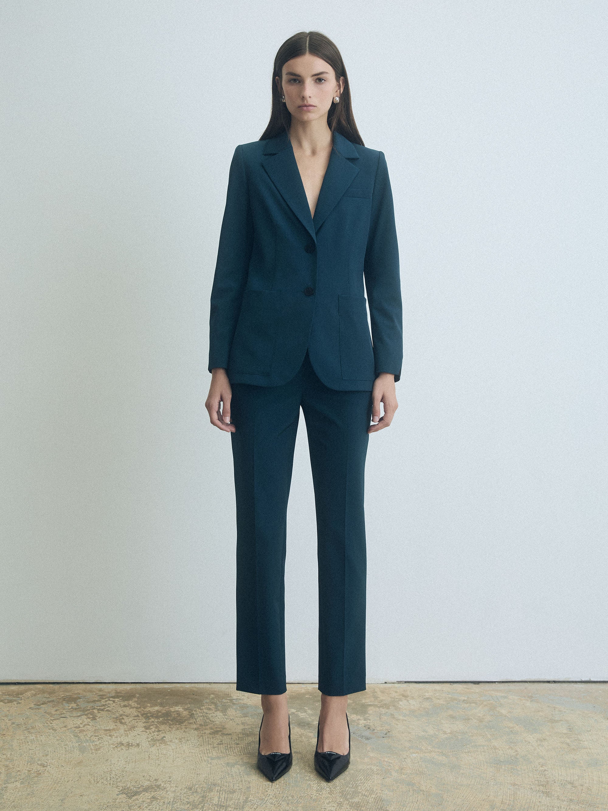 Woman wearing Deep Ocean Judith & Charles mid-rise slim pants in unlined Easy Care Techno fabric, ankle length