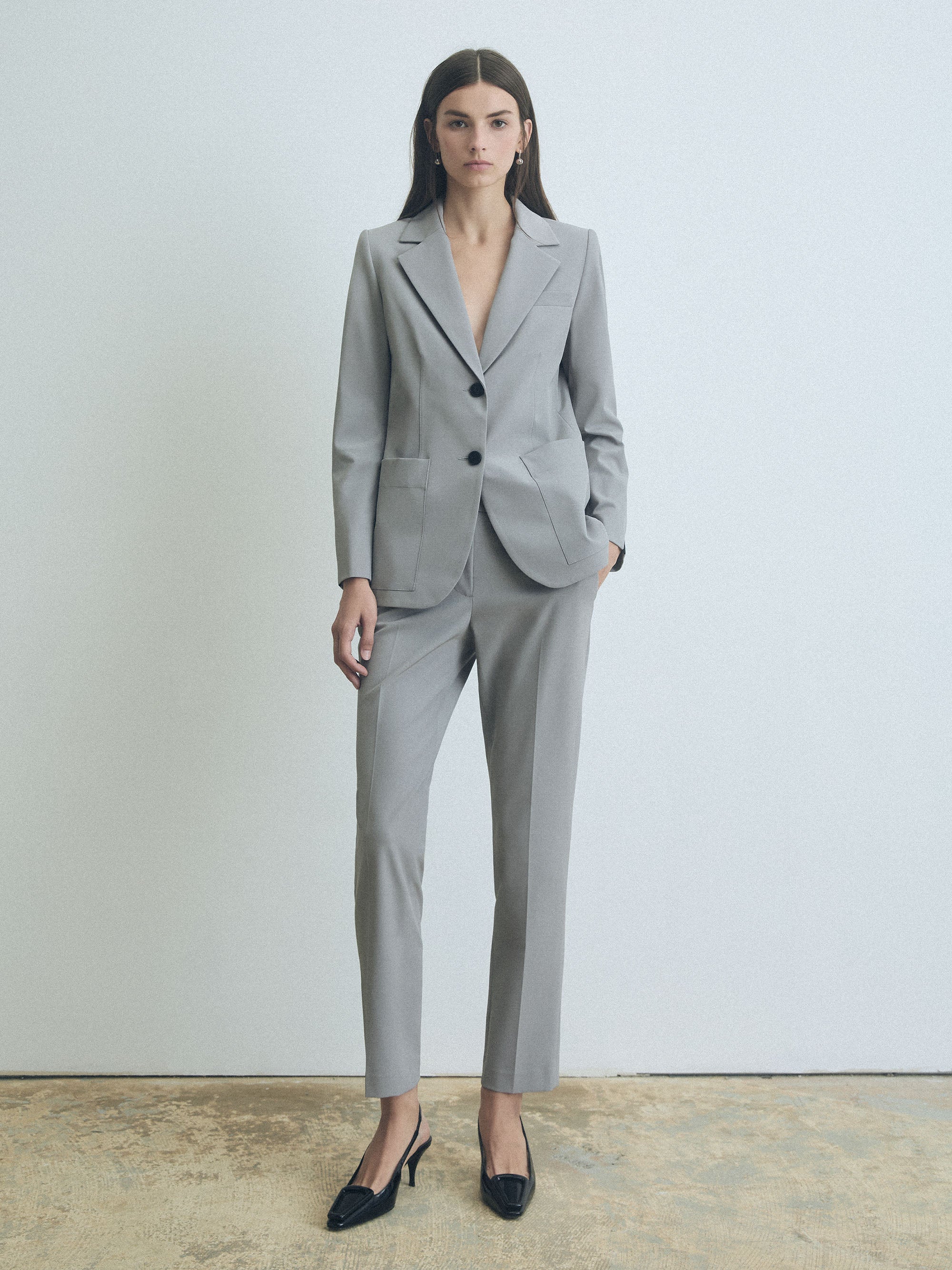 Woman wearing silver Judith & Charles mid-rise slim pants in unlined Easy Care Techno fabric, ankle length