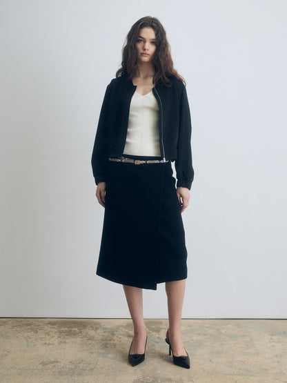 Black zip‑front jacket styled with a straight skirt for a refined, minimal look