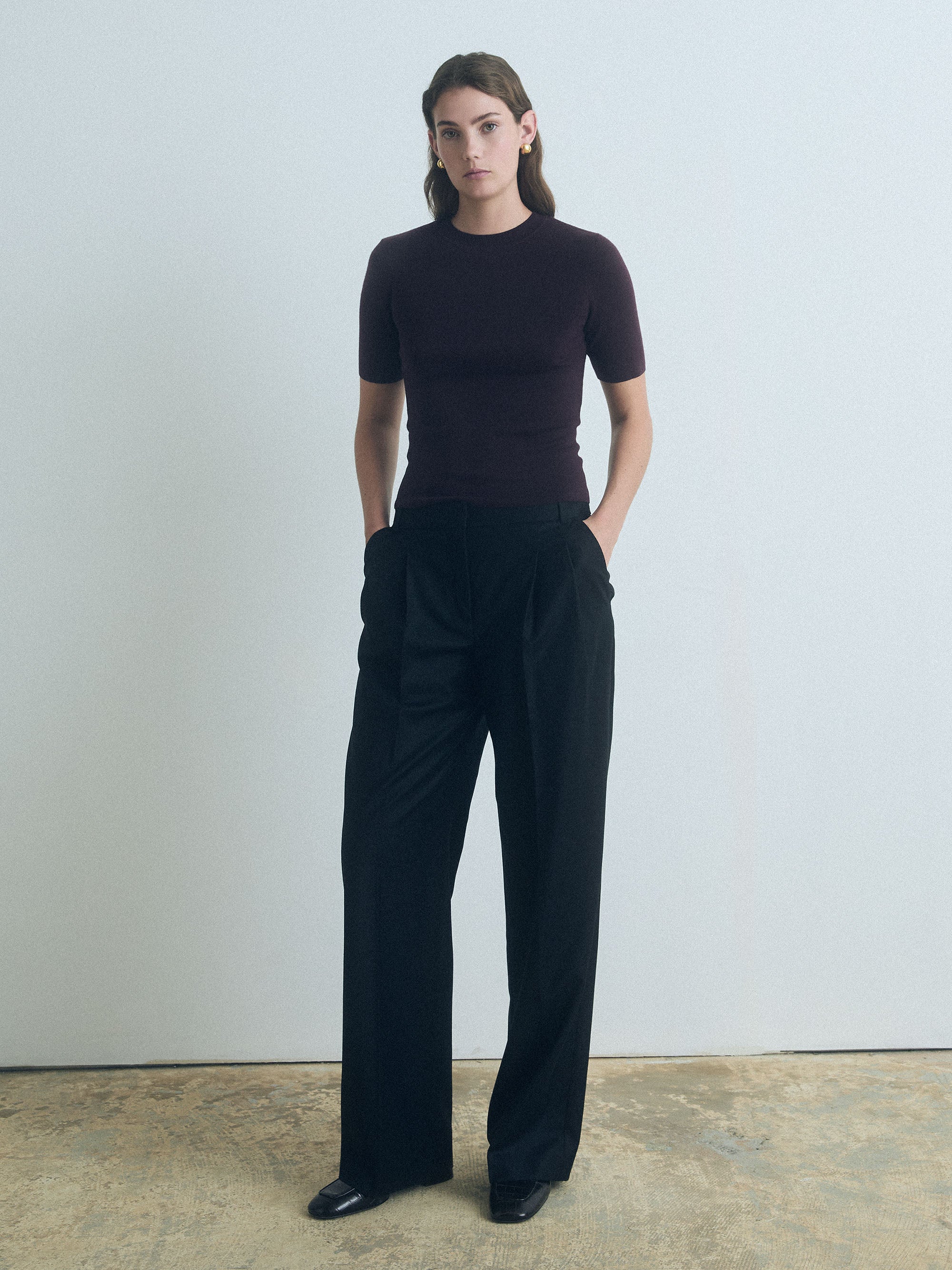 Woman wearing dark cherry Short Sleeve Sweater with crew neck by Judith & Charles. 