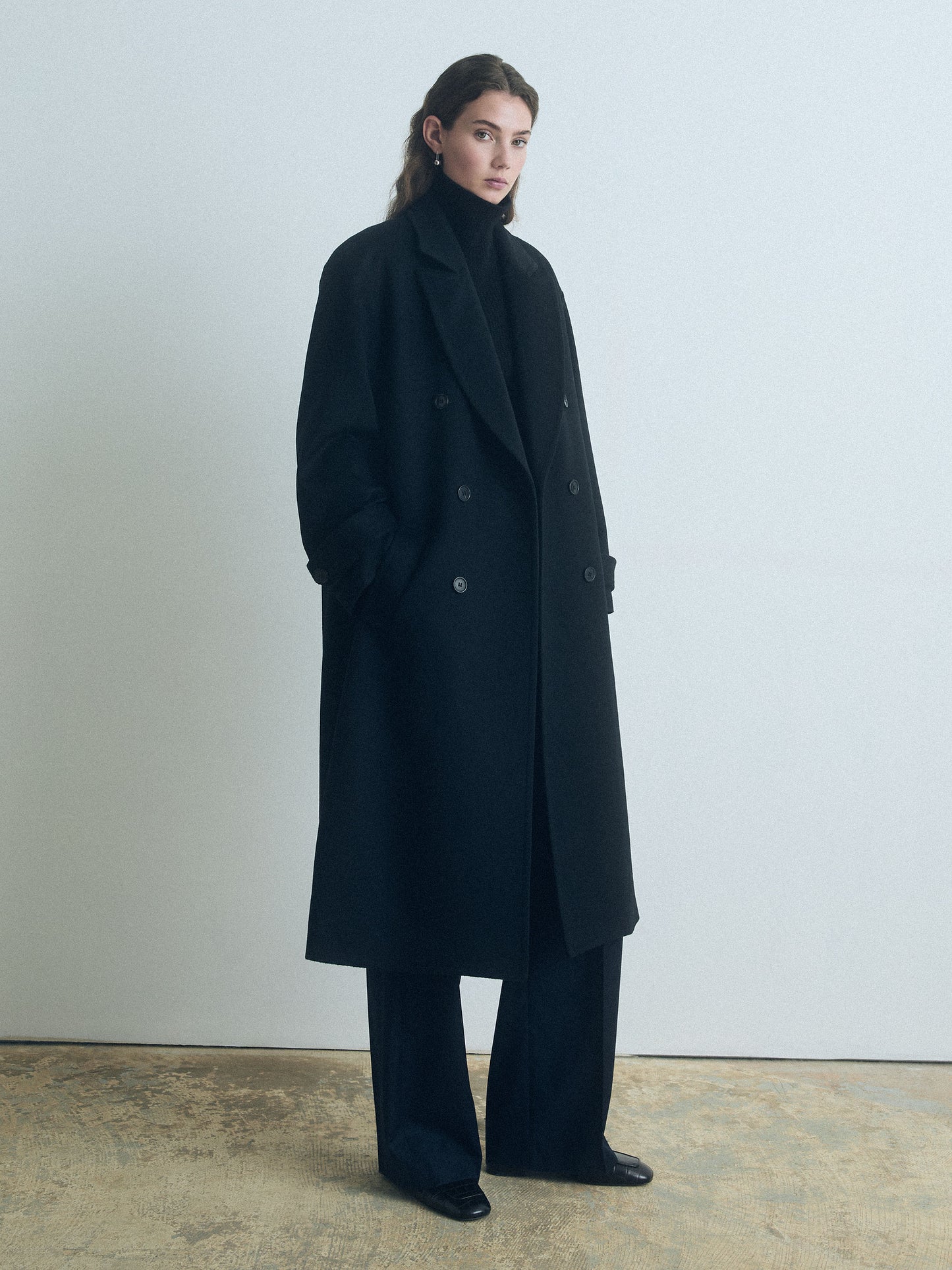 Drop Shoulder double breasted long black coat in wool cashmere by Judith & Charles 