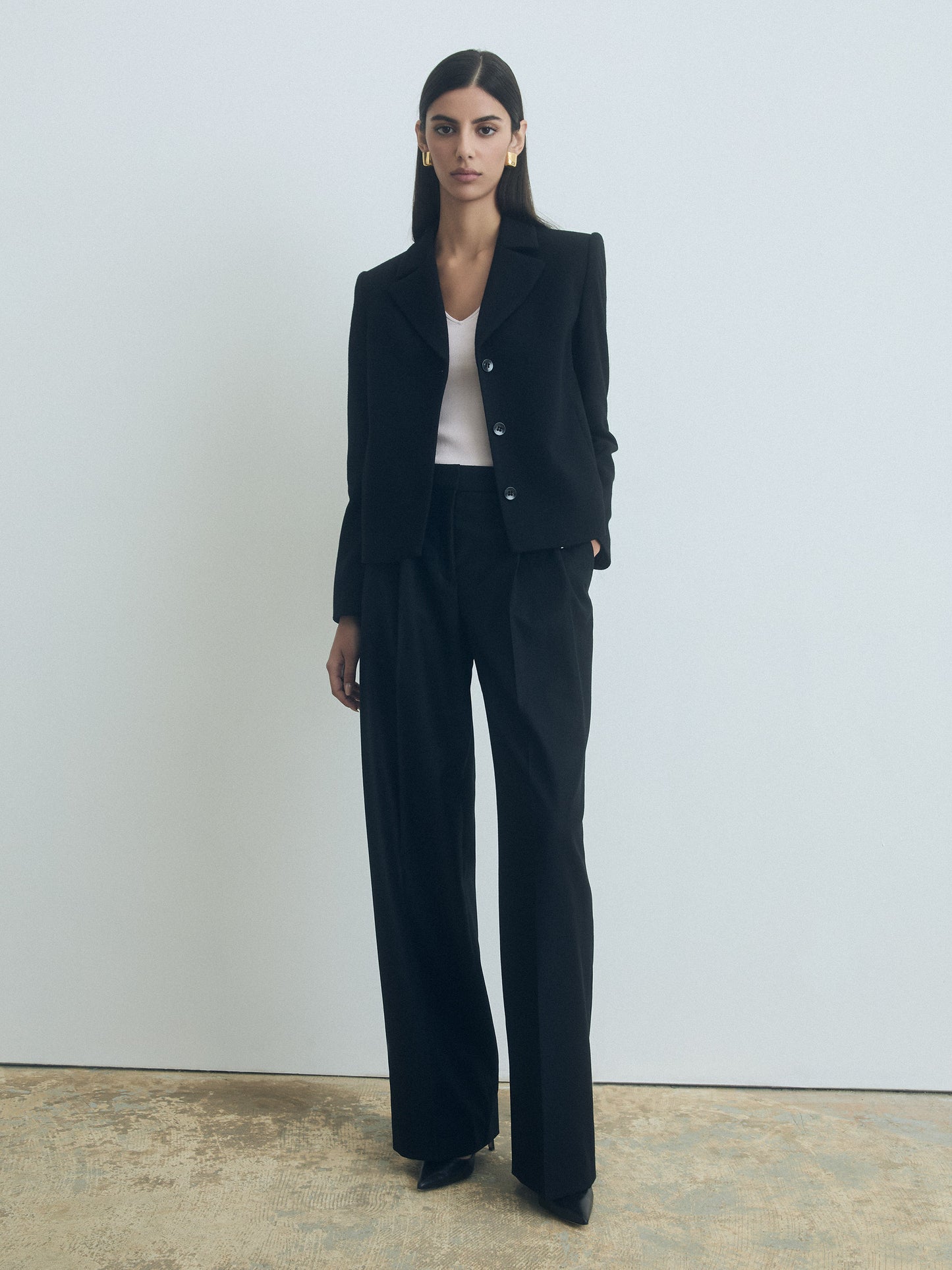 Woman wearing the black Pax tailored jacket by Black and Judith & Charles, made in Canada from 100% wool with full polyester lining, style number 674-1988