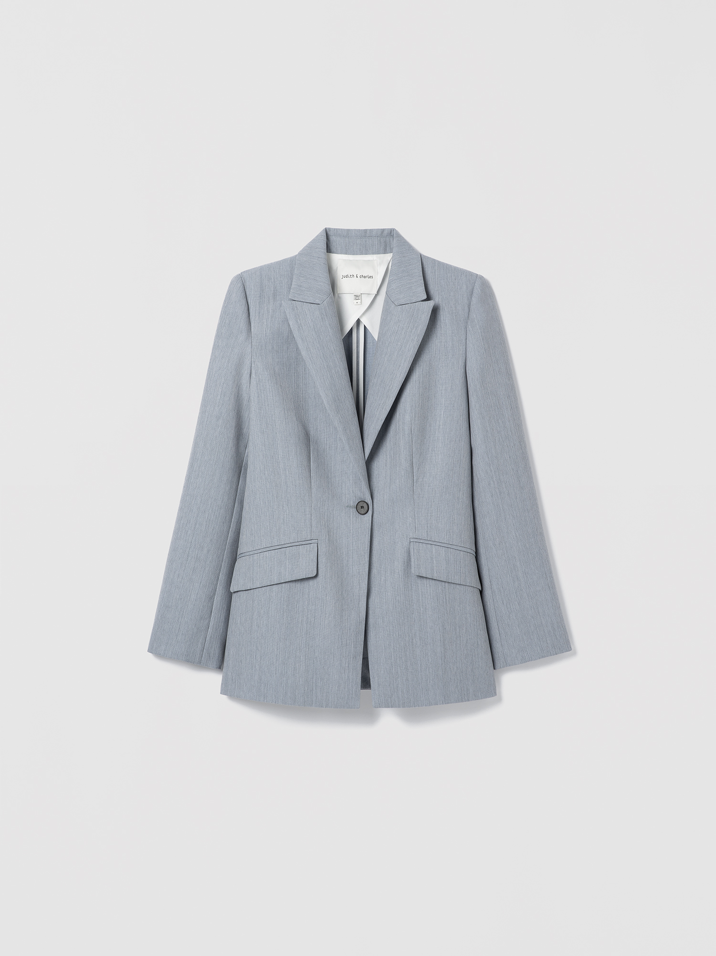Light blue blazer on a light gray background