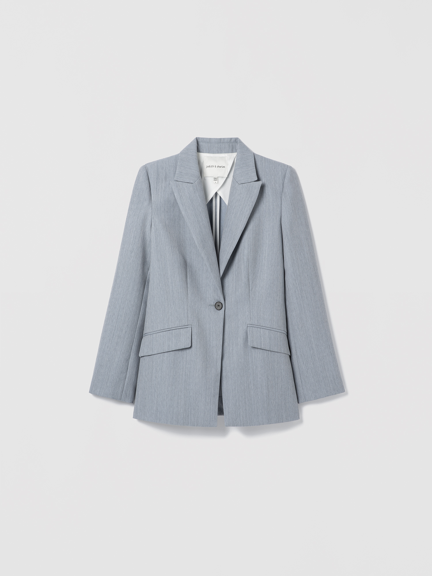 Light blue blazer on a light gray background
