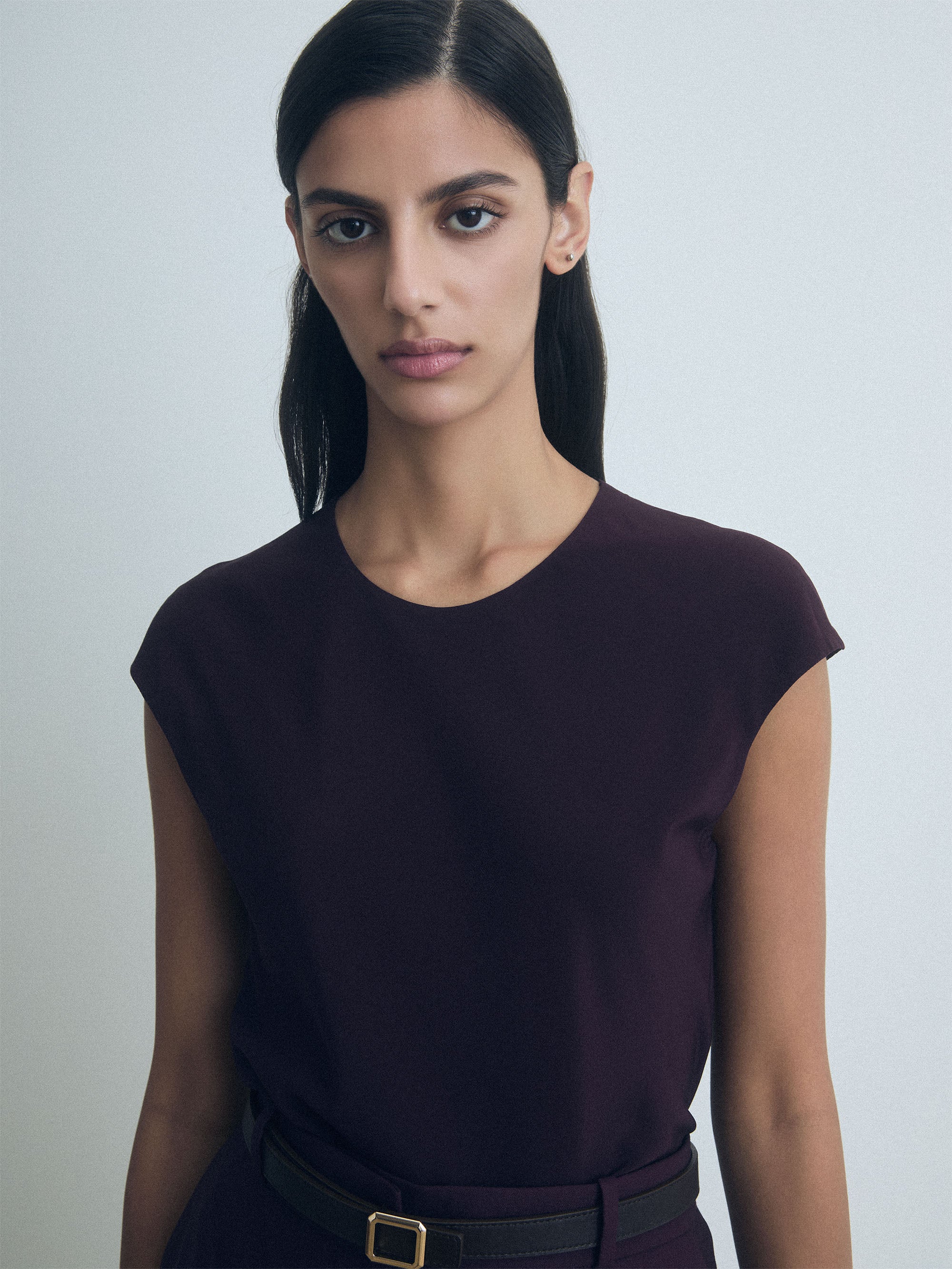 Woman wearing Judith & Charles dark cherry crew neck top — double-layer front, bias cut, back keyhole with button.