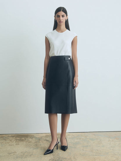 Woman wearing Judith & Charles white silk crew neck top — double-layer front, bias cut, back keyhole with button.