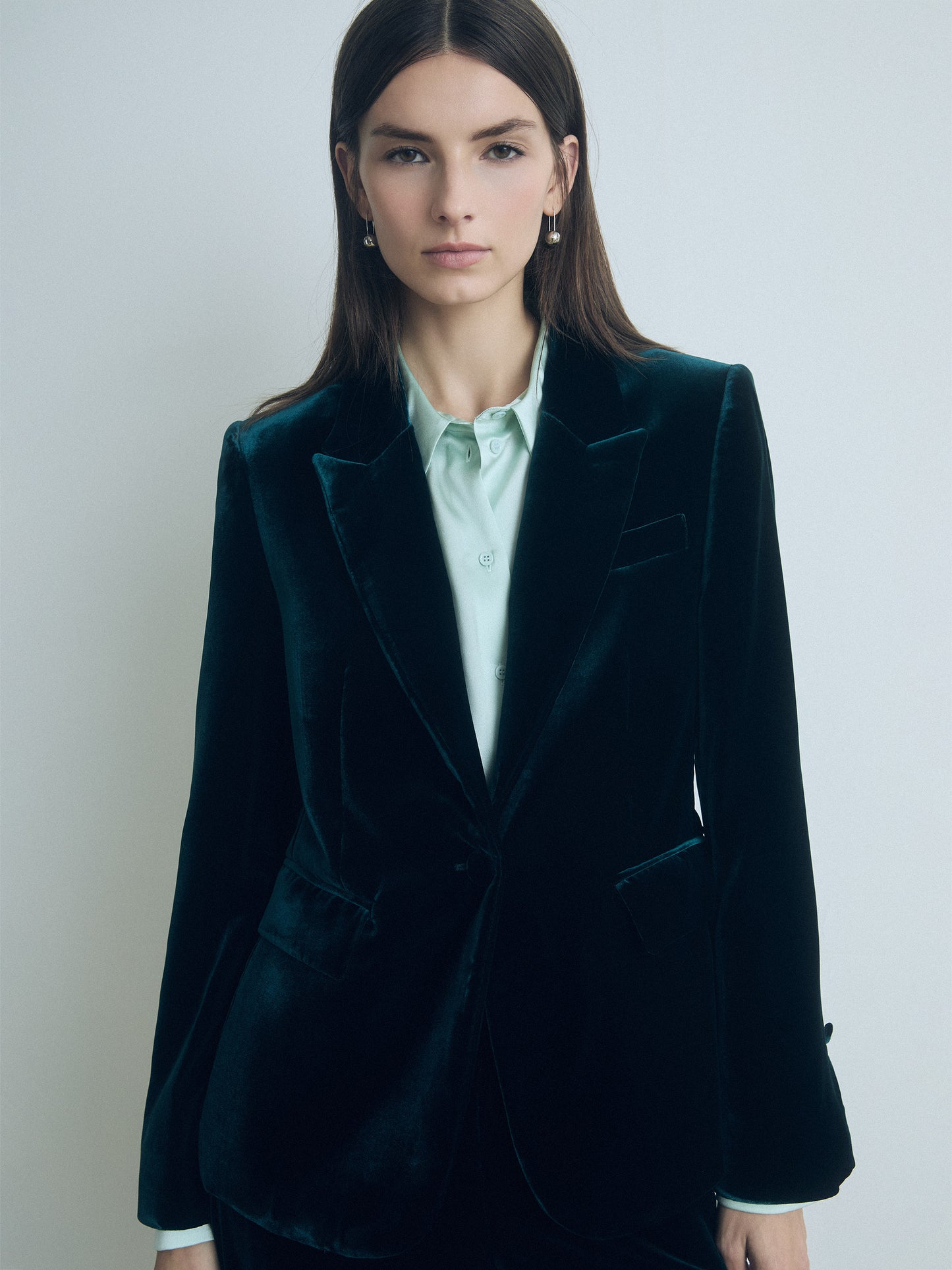 Model wearing emerald classic fit 1-button velvet jacket with peak lapel, flap and chest pockets, fully lined, made in Portugal from Italian fabric