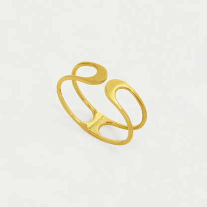 Gold cuff with a modern design on a light gray background