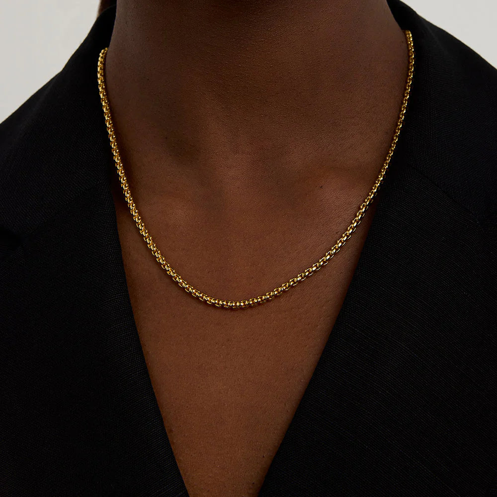 Woman wearing a gold necklace