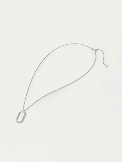 Silver necklace on a light gray background