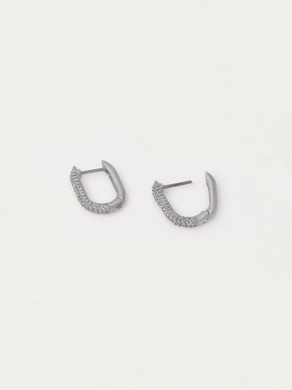 Pair of silver hoop earrings on a light gray background