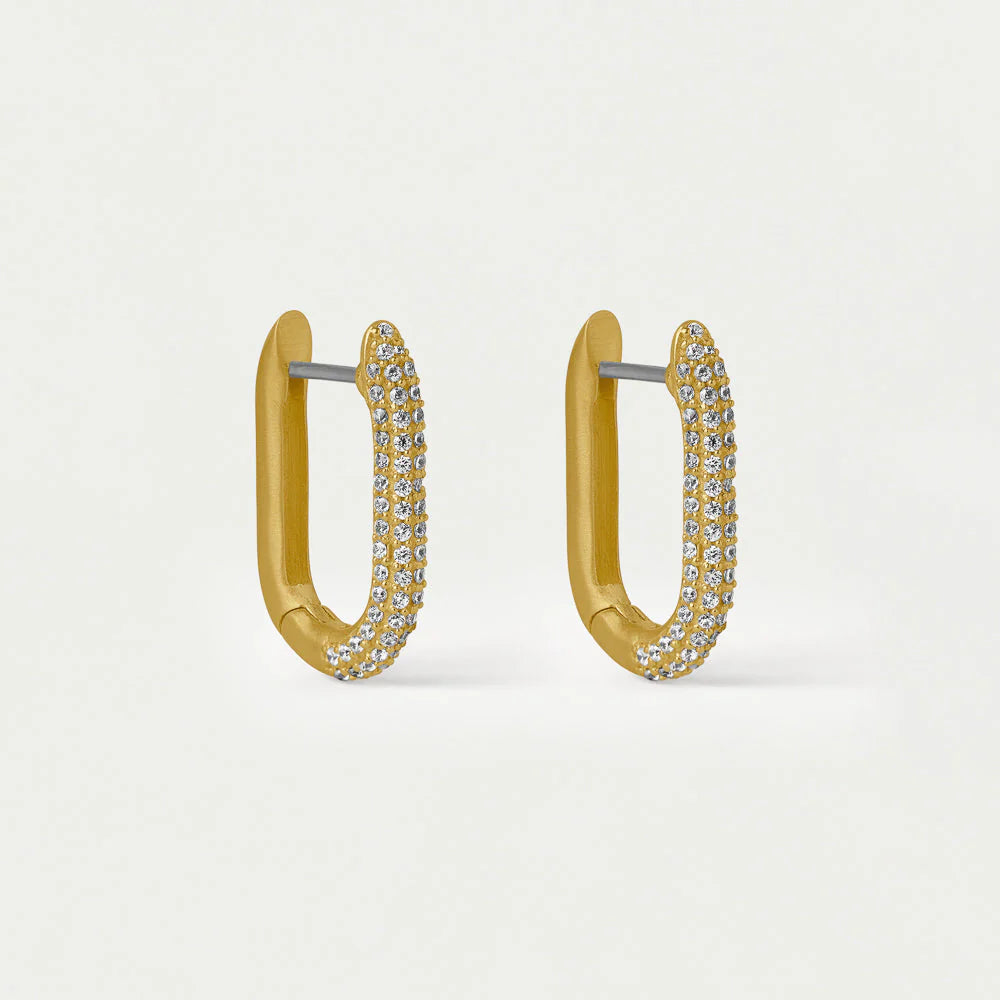 Gold hoop earrings with clear gemstones on a light gray background