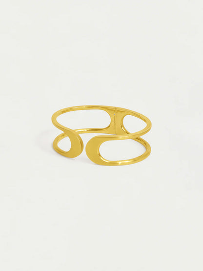 Gold ring with a unique design on a white background