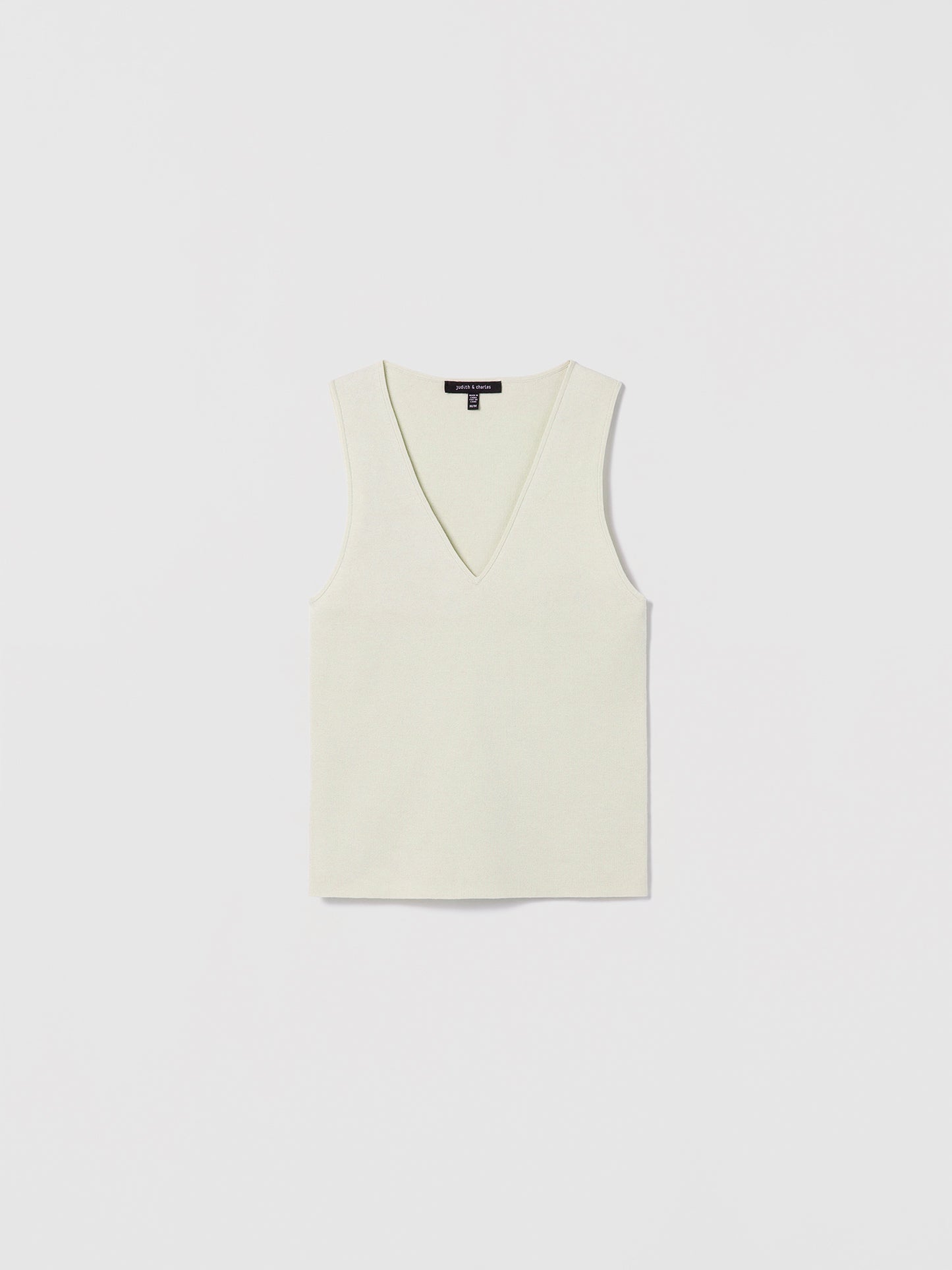 Crema sleeveless V-neck shell top by Judith and Charles, made from a fine Italian silk-cotton blend. Features a fitted silhouette and a 21.5" back length. Style code: 266-4133.