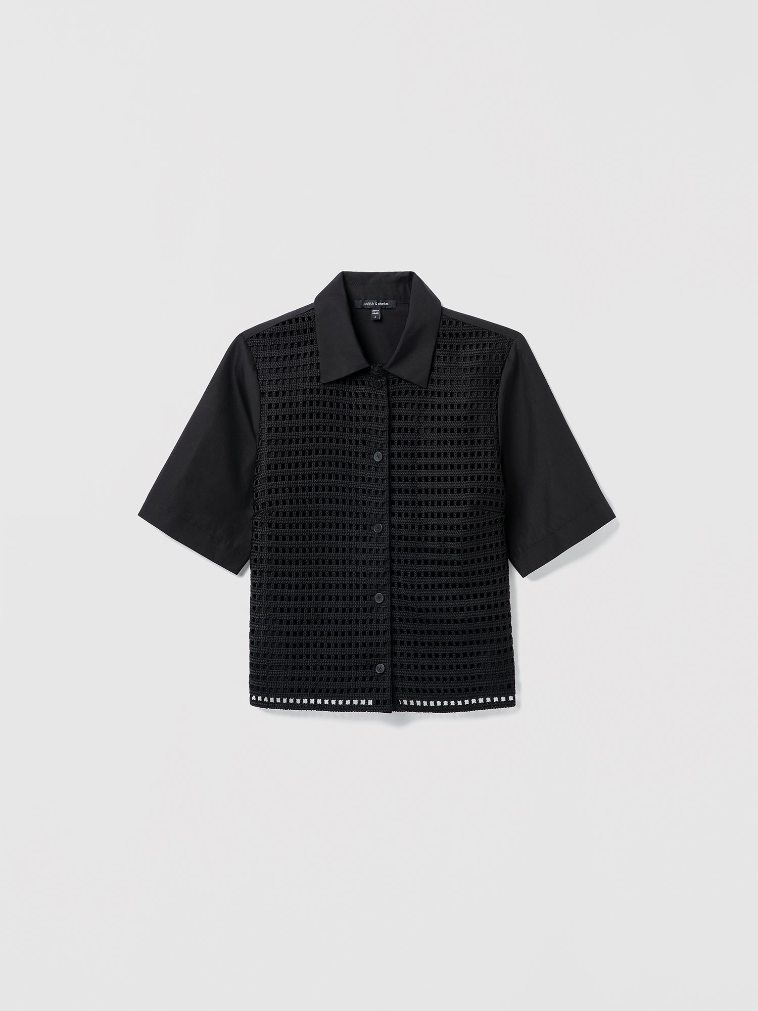 Black textured shirt on a light gray background