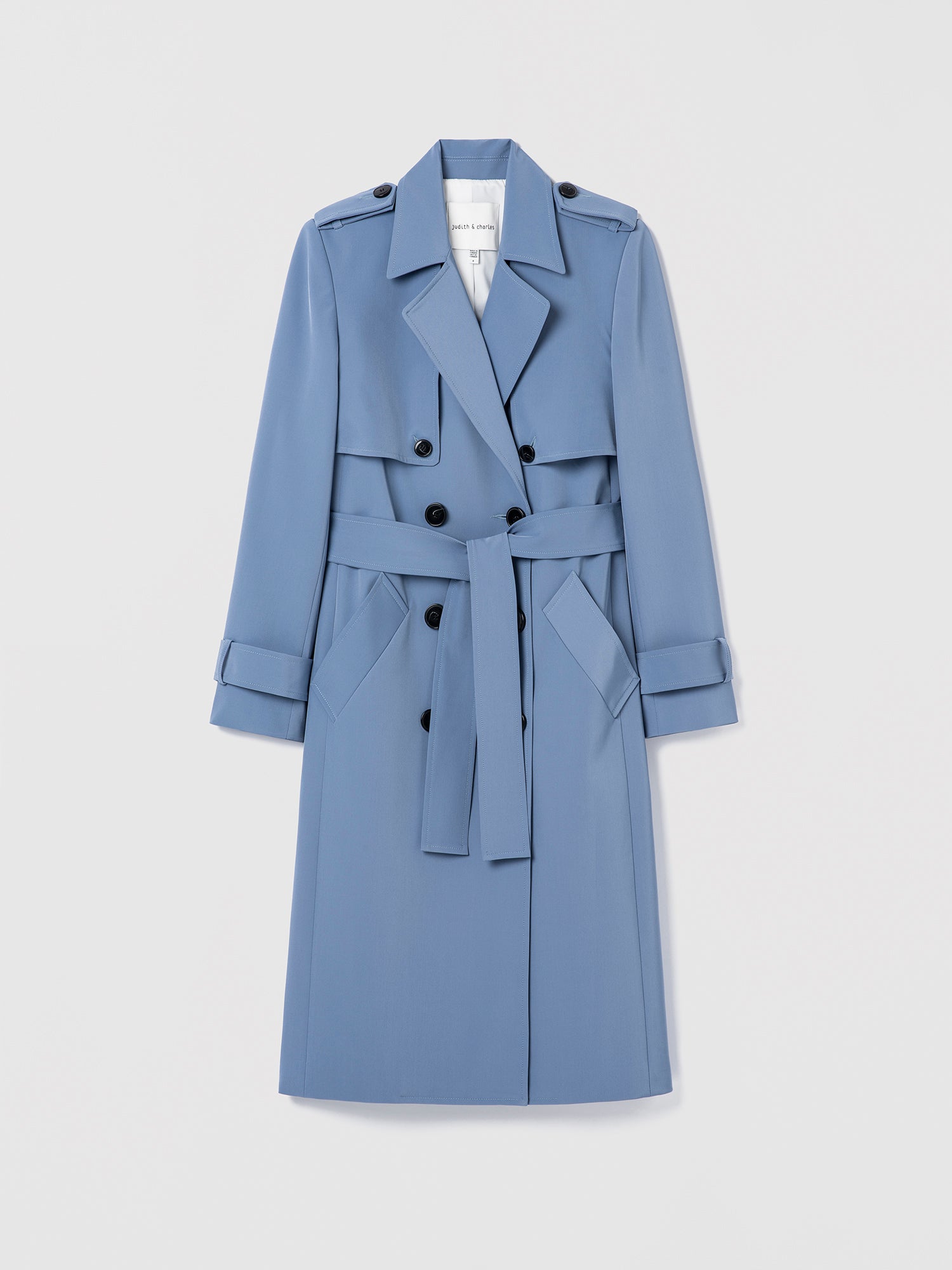 Blue trench coat on a light gray background