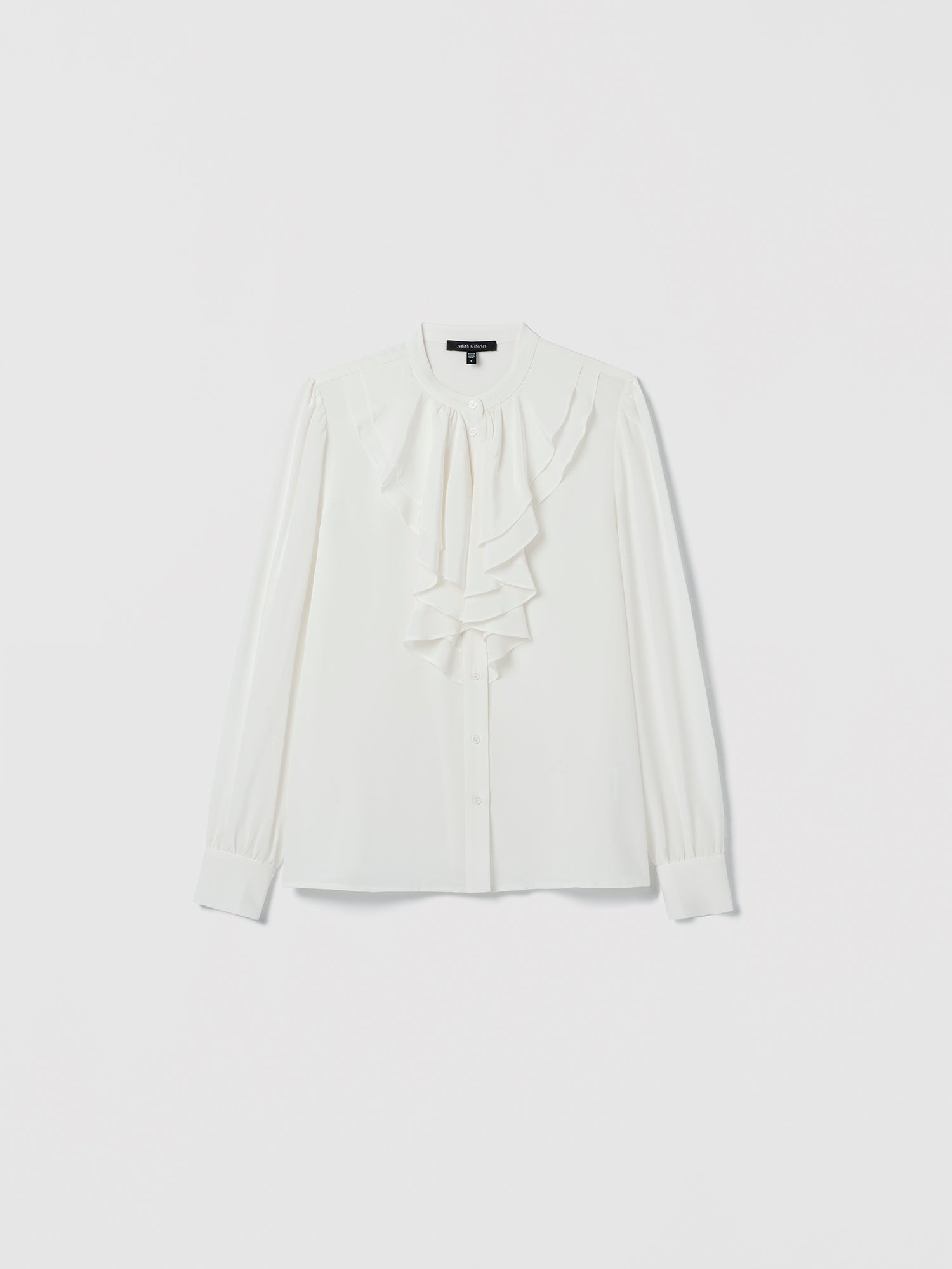 Off White blouse with a bow detail on a light gray background