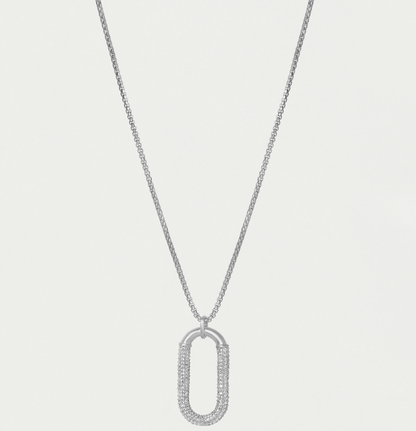 Silver necklace with a unique pendant on a light gray background
