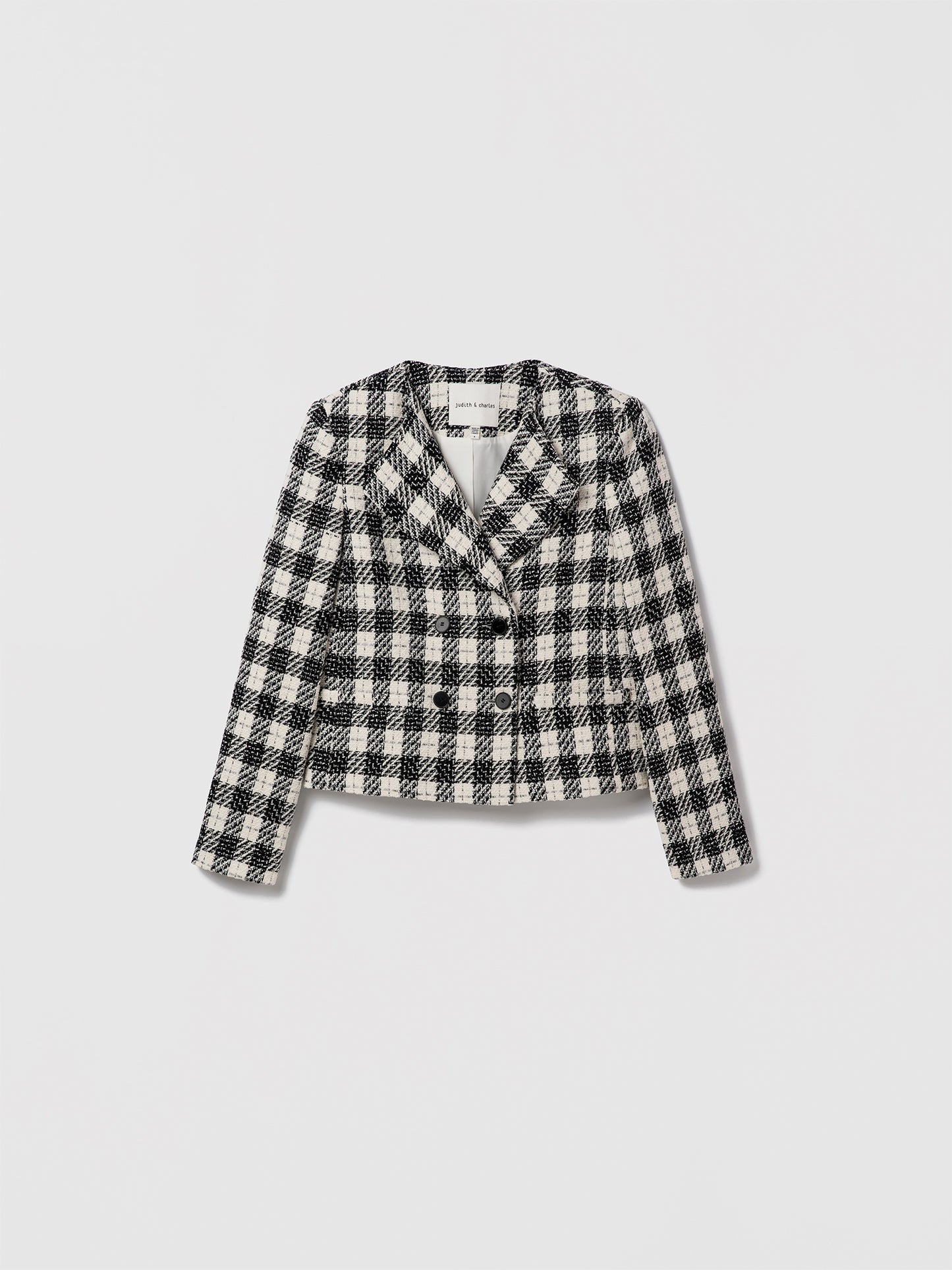 Black-and-white cropped check double-breasted jacket by Judith & Charles.