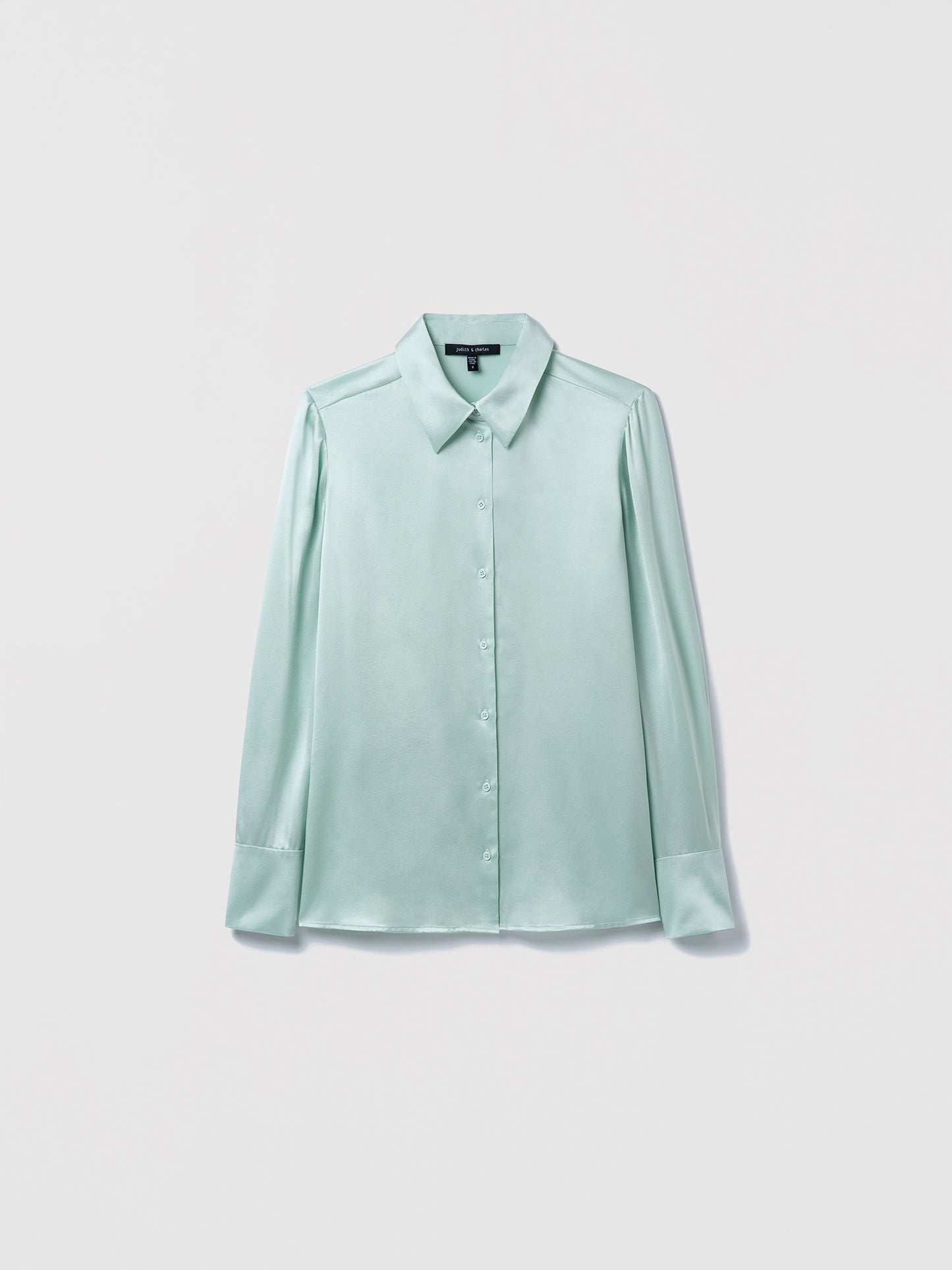 Light sage blouse on a white background