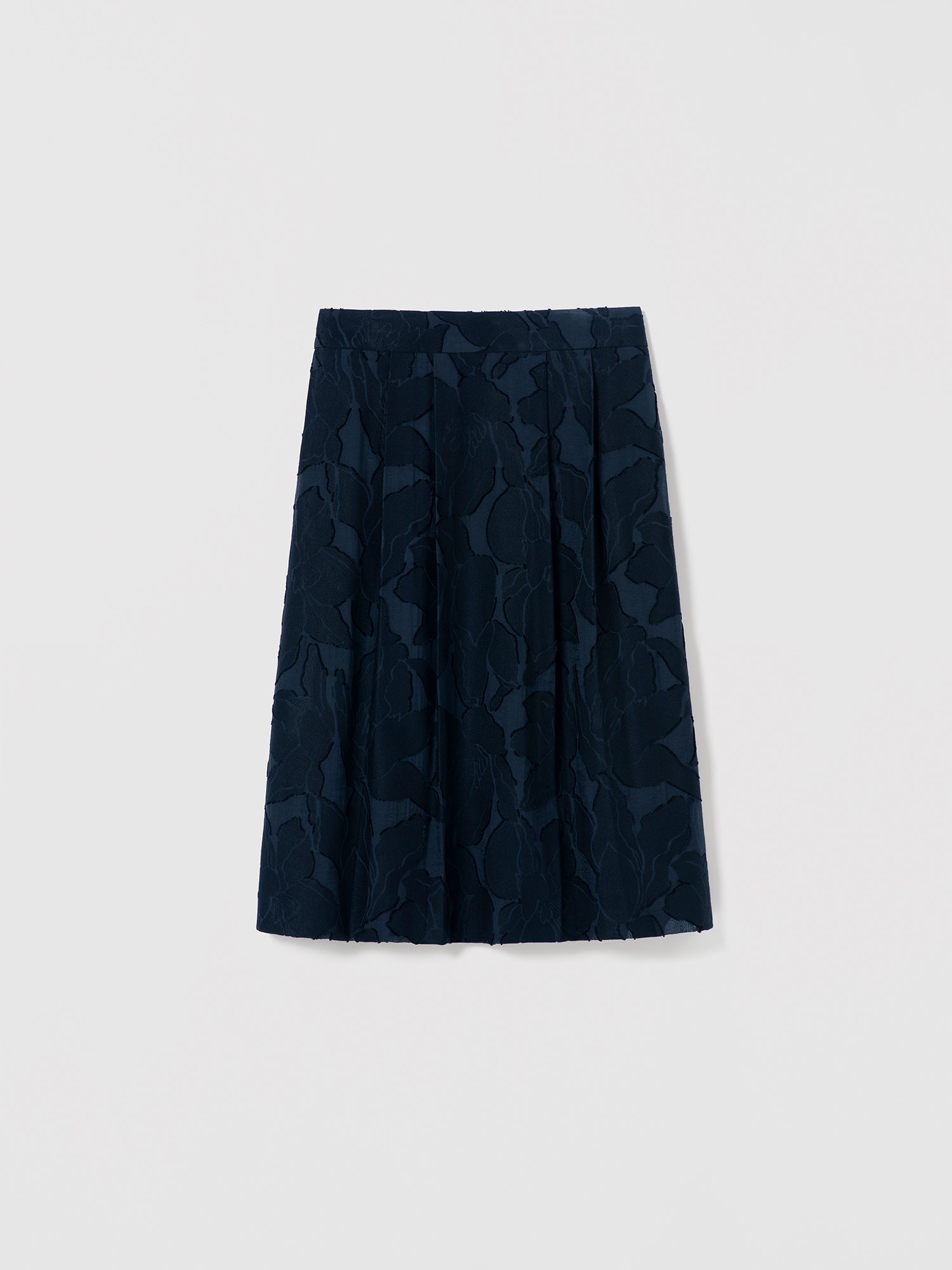 Navy blue skirt with geometric pattern on a light gray background
