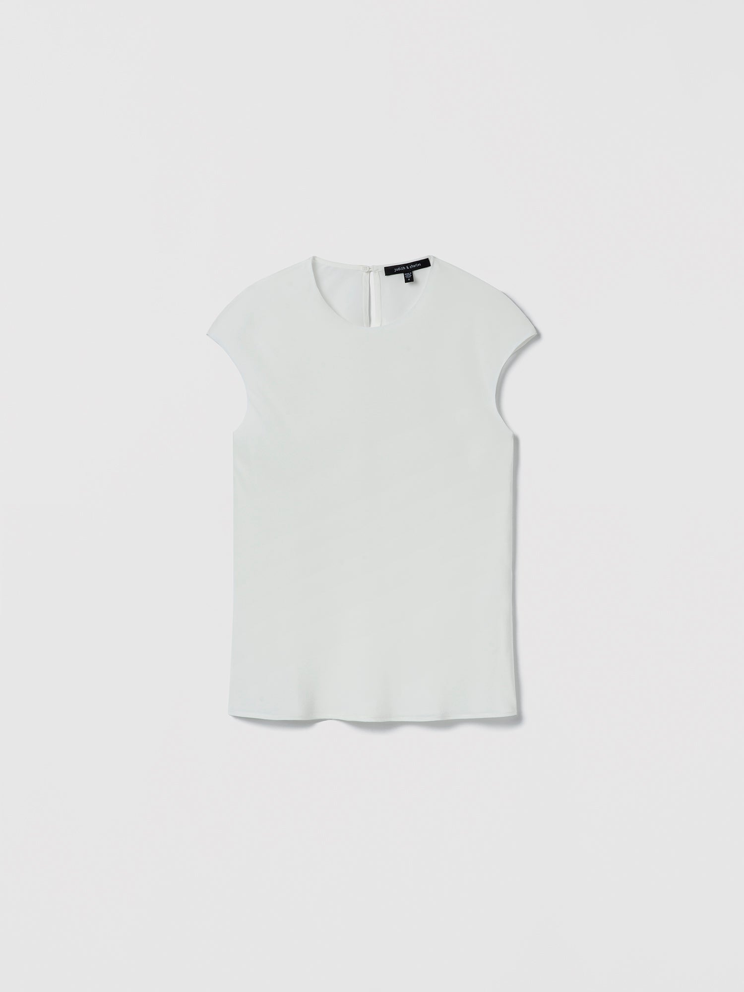 Judith & Charles white silk crew neck top — double-layer front, bias cut, back keyhole with button.