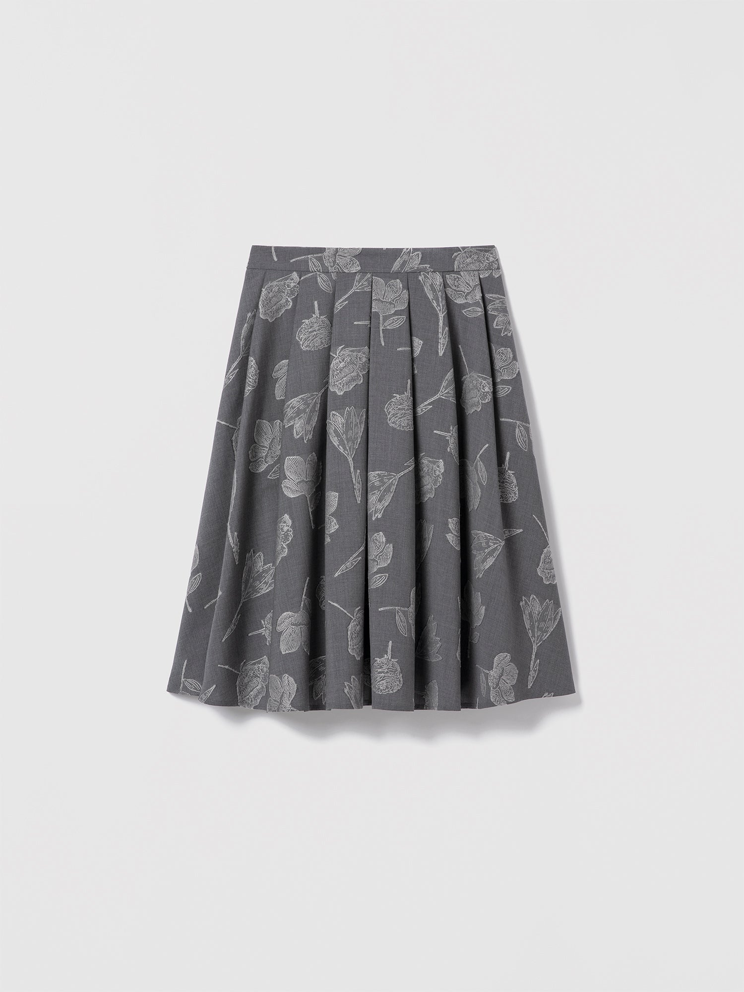 Grey floral jacquard skirt in stretch virgin wool by Loro Piana, below-the-knee length with side seam pockets, clean waist, and invisible back zipper. Unlined. Made in Canada with Italian fabric. Mecca Skirt, style 725-2531 by Judith & Charles