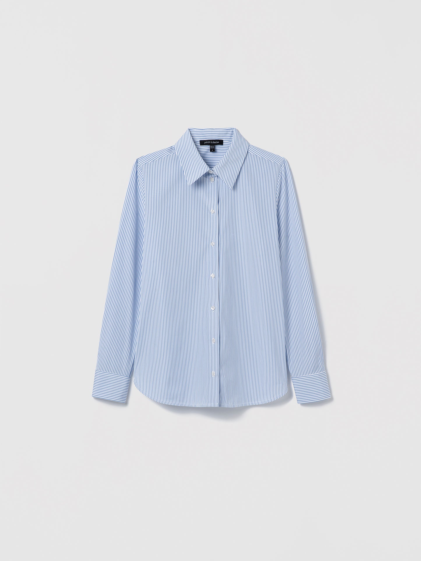 Flat-lay of a blue striped cotton poplin shirt with long sleeves, spread collar, and button closure