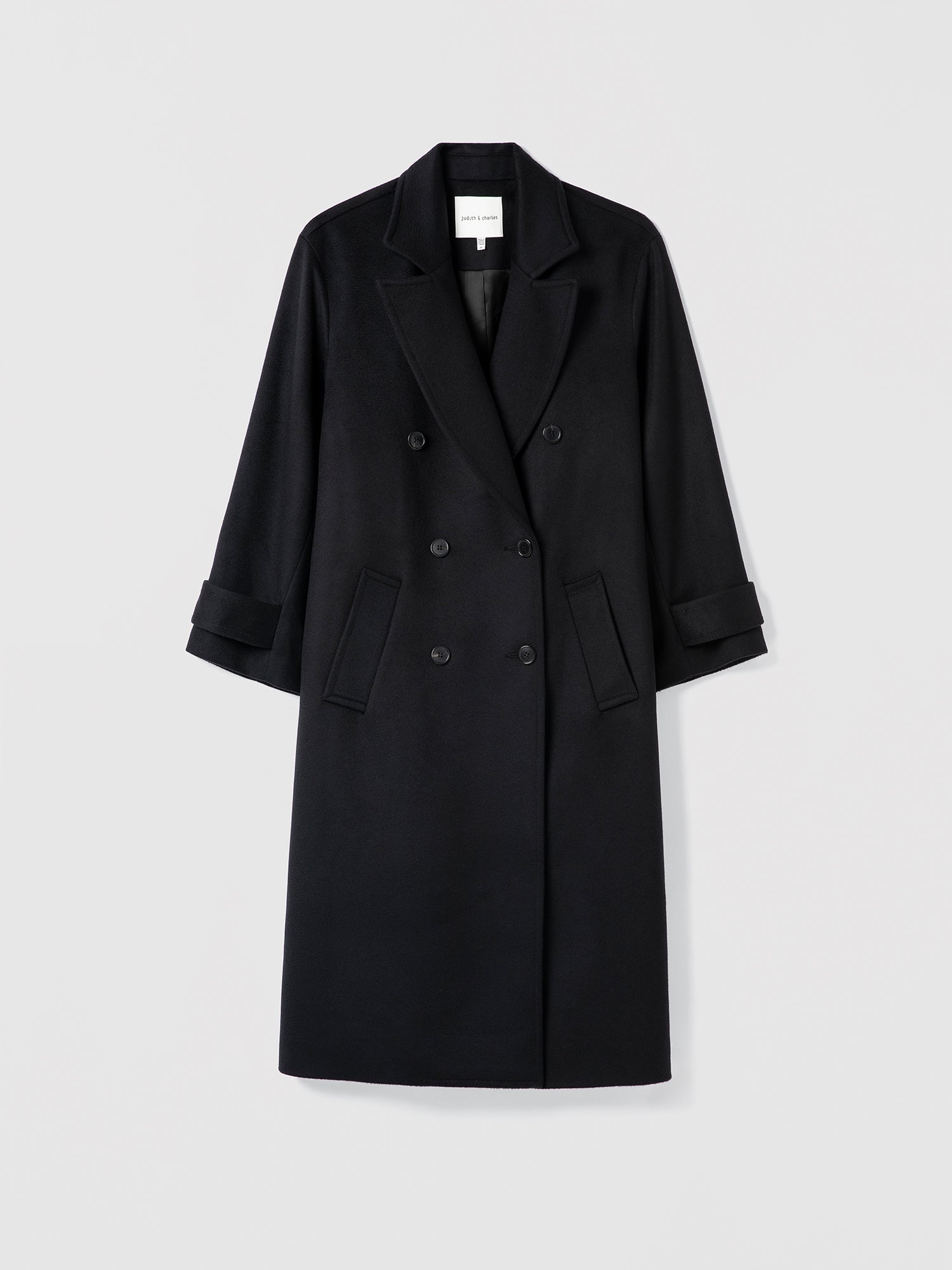 Black overcoat on a light gray background