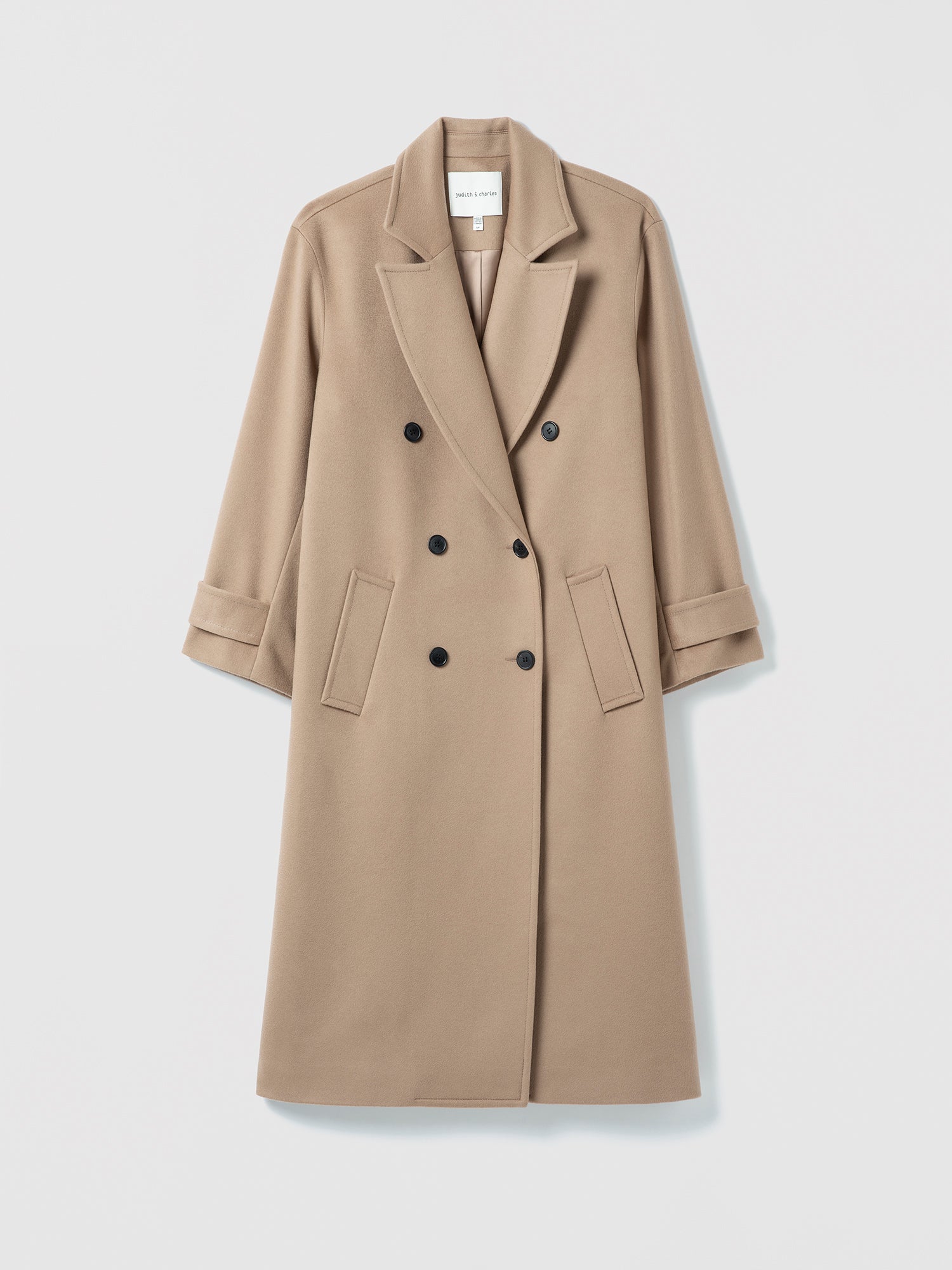 Beige overcoat on a light gray background