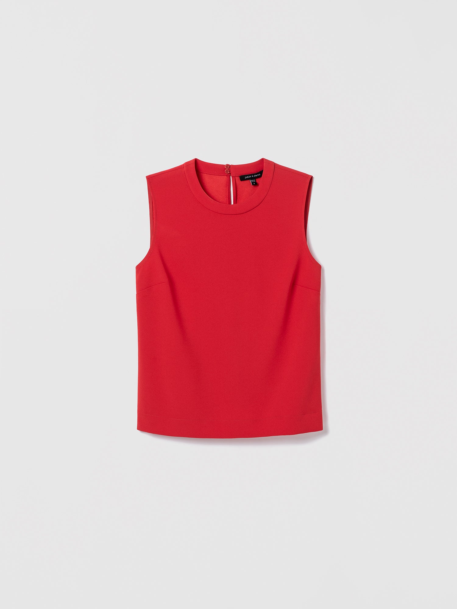 Red sleeveless top on a light gray background