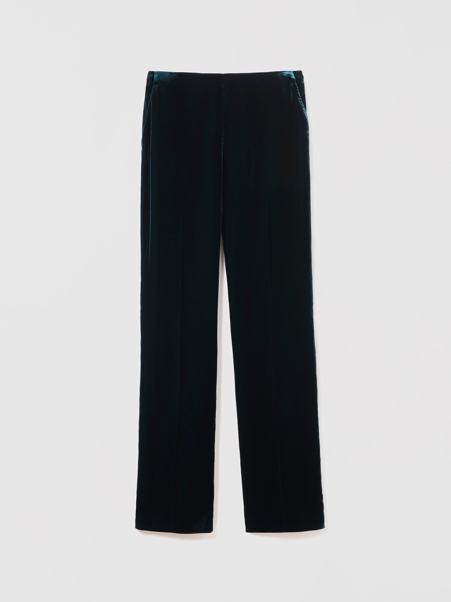 Emerad velvet pants on a light gray background