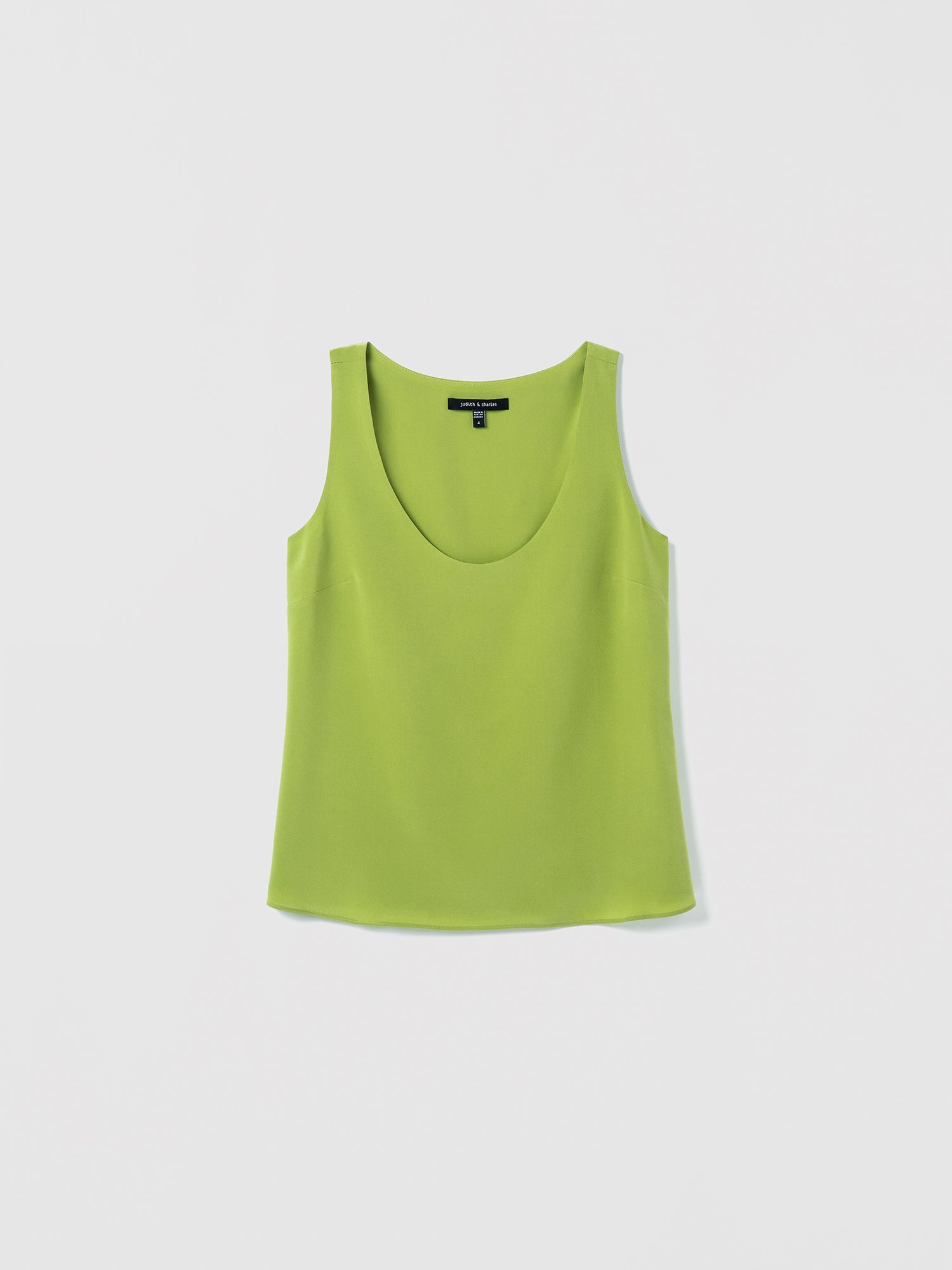 Flat of a clean scoop‑neck tank in silk, doubled in self fabric for a smooth, structured finish