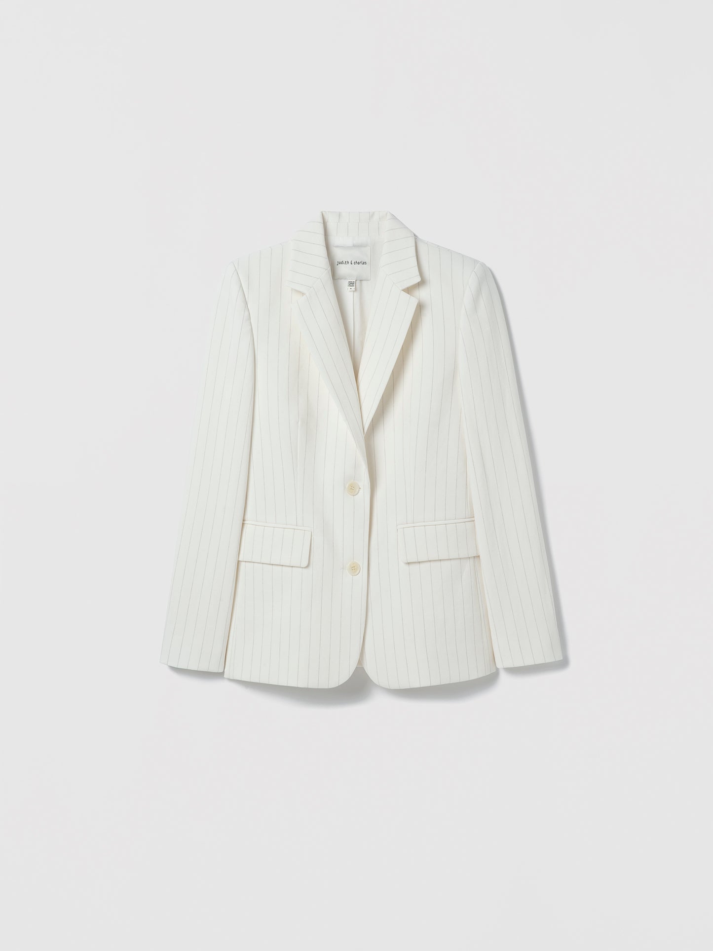 White blazer on a light gray background