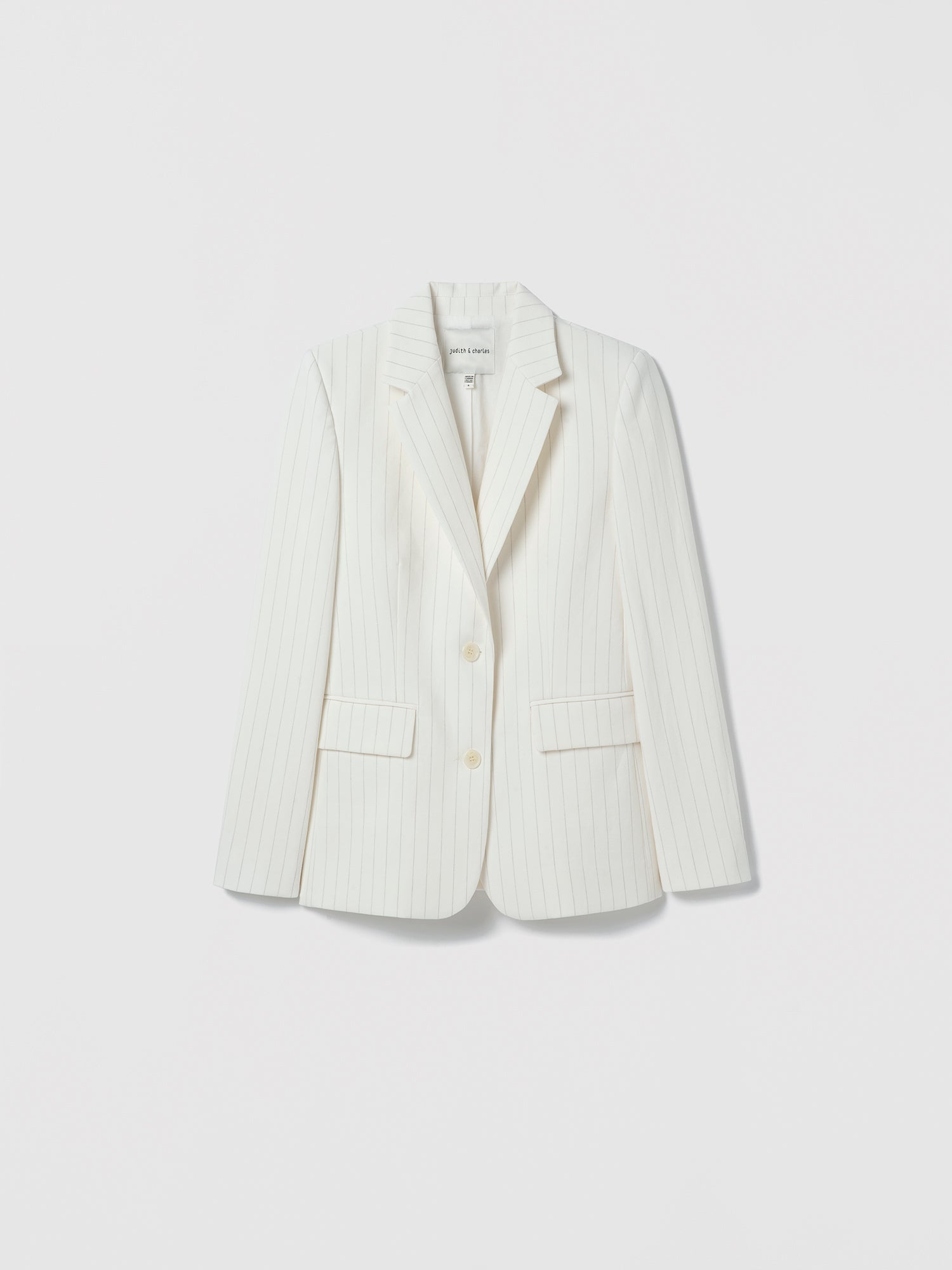 White blazer on a light gray background