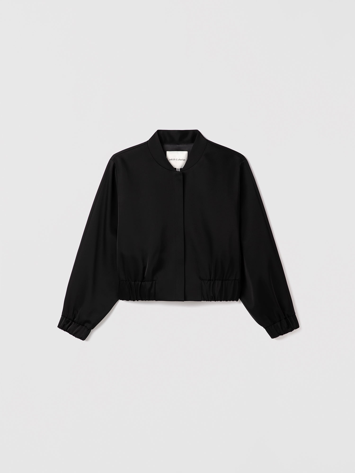 Black zipper jacket on a light gray background