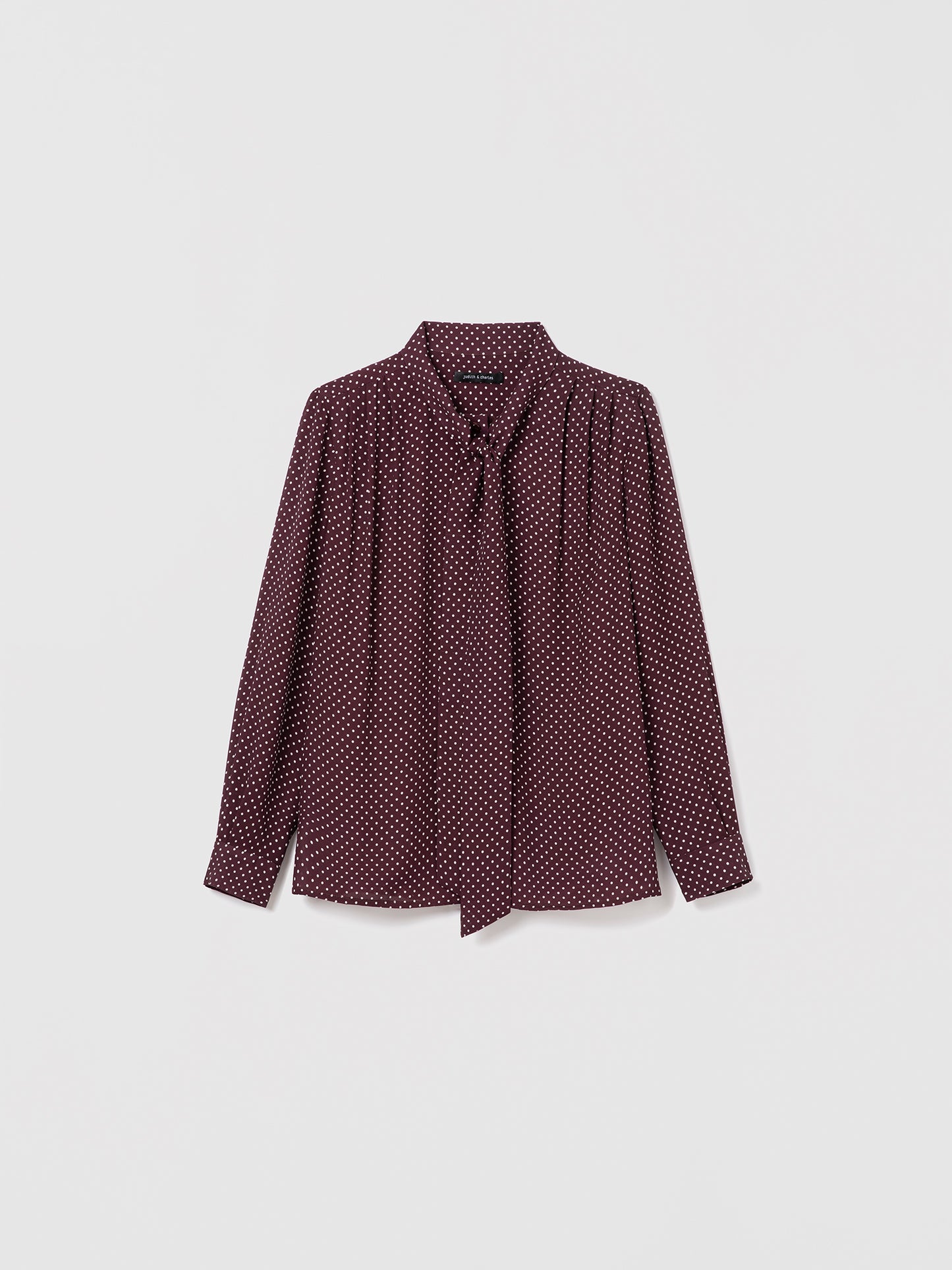Judith & Charles cherry dot silk blouse with long sleeves, pleats, and neck tie. Straight fit, unlined, with button closure.